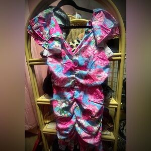 Floral scrunchie dress with flutter sleeves.
